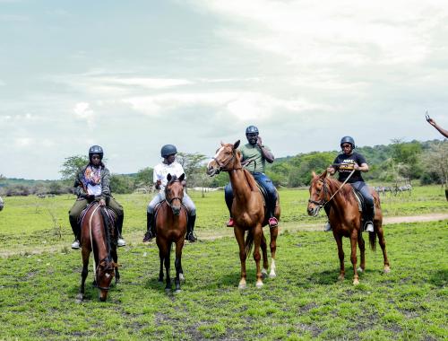 Tourists On Horse Riding Safari In Lake Mburo National Park in Western Uganda 